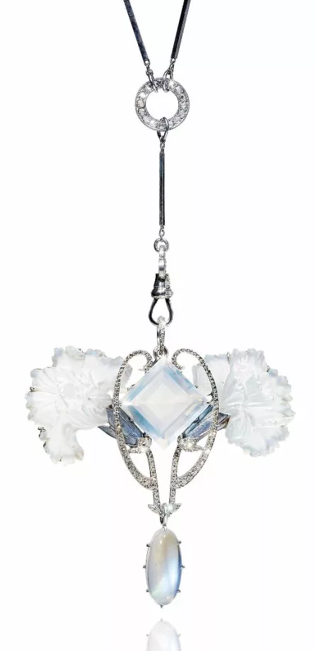 An art nouveau moonstone pendant, by René Lalique, featuring a luminous square-cut moonstone centerpiece, intricately carved floral motifs, diamond-set scrollwork, and a suspended oval cabochon moonstone, all set in an elegant platinum design.