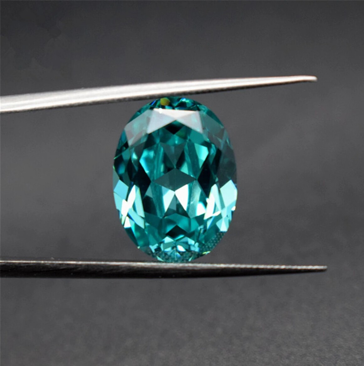 A radiant Paraíba Tourmaline gemstone with vivid electric blue-green color, exemplifying a top choice for gemstone investments.
