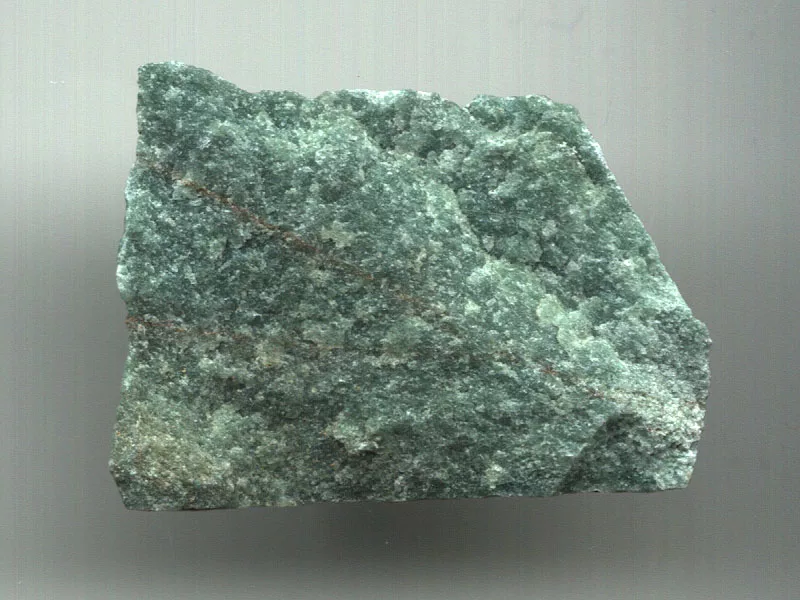 A rough, green mineral specimen featuring a granular texture and subtle sparkling inclusions, characteristic of natural Aventurine quartz.