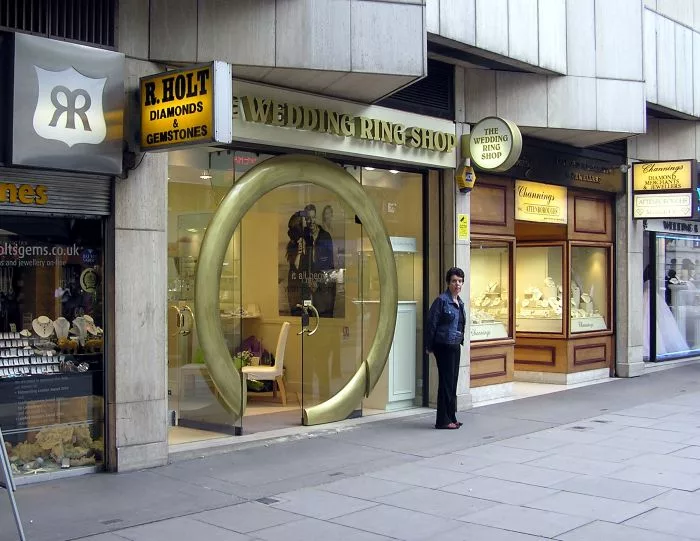 Street scene featuring jewelry shops and signage in London's Hatton Garden, symbolizing its role in the Global Gemstone Trade.