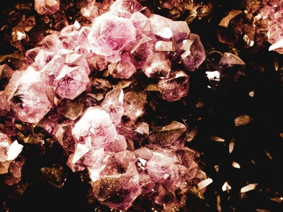 A detailed world map with numerous interconnected points and lines representing international trade routes, overlaid with icons of gemstones and digital data elements, symbolizing the complex network and exchange in the Global Gemstone Trade.