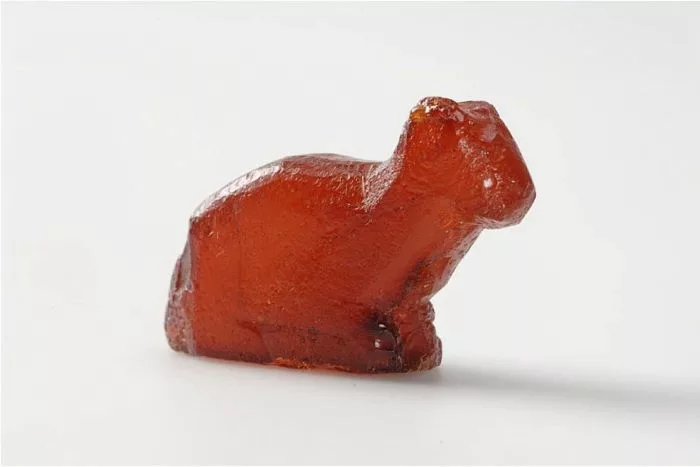 Discovered at Birka in Sweden, this Viking Age amber figurine, measuring about three inches (7.6 centimeters) in length and resembling a seated cat, likely served as a decorative ornament. Photo: The Swedish History Museum (CC BY-SA 2.5)